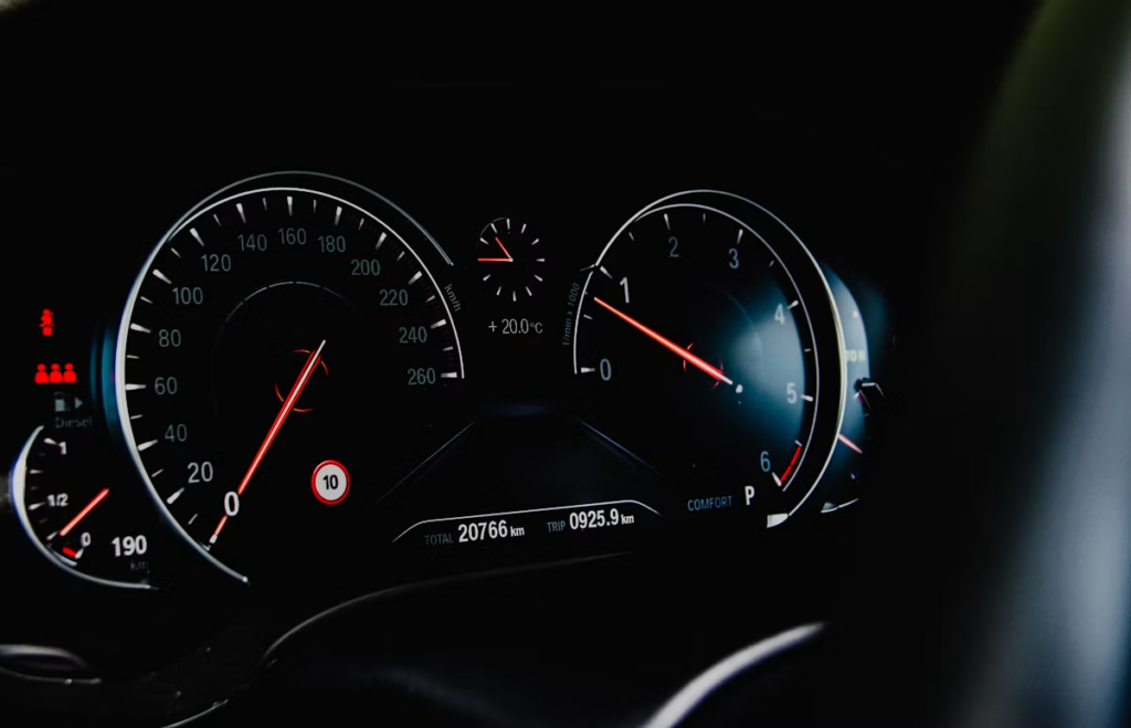A BMW dashboard displaying odometer in km.