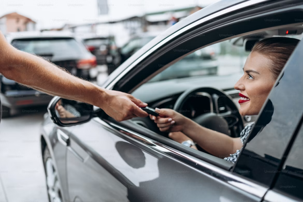 What Does Car Service Include: Customer receiving car keys.