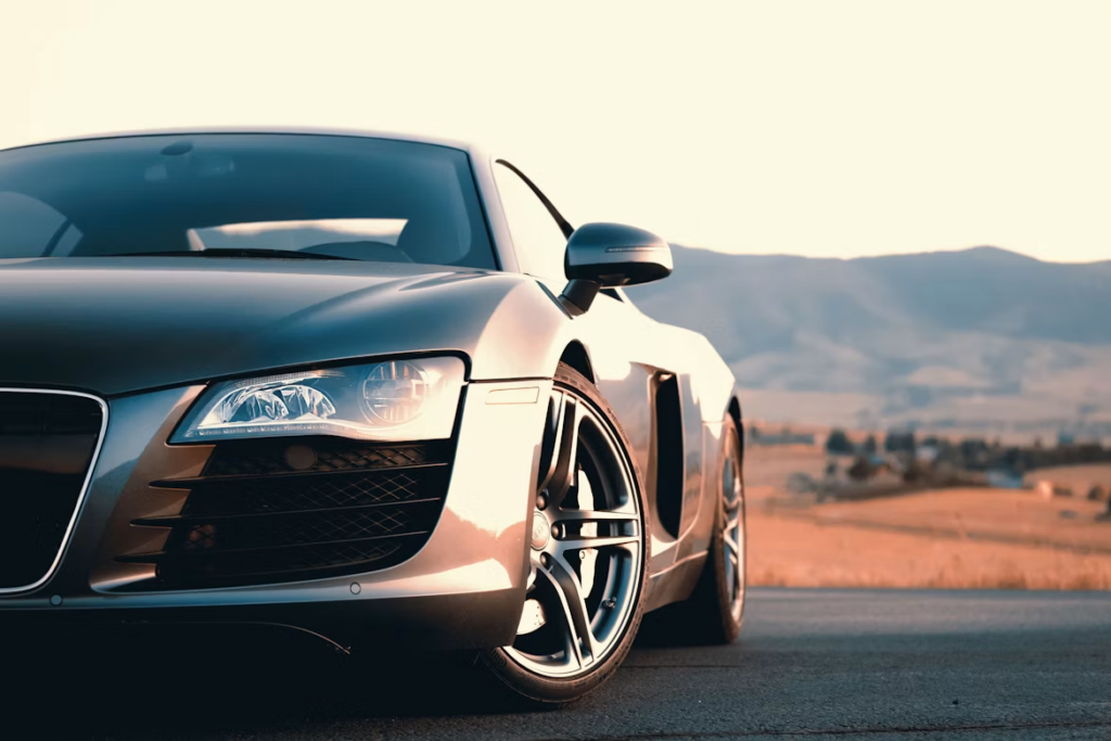 What Does Car Service Include: Silver sports car during sunset.