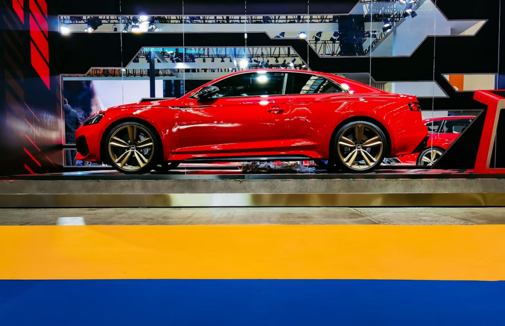 How to check a car's service logbook: a shiny new red car.