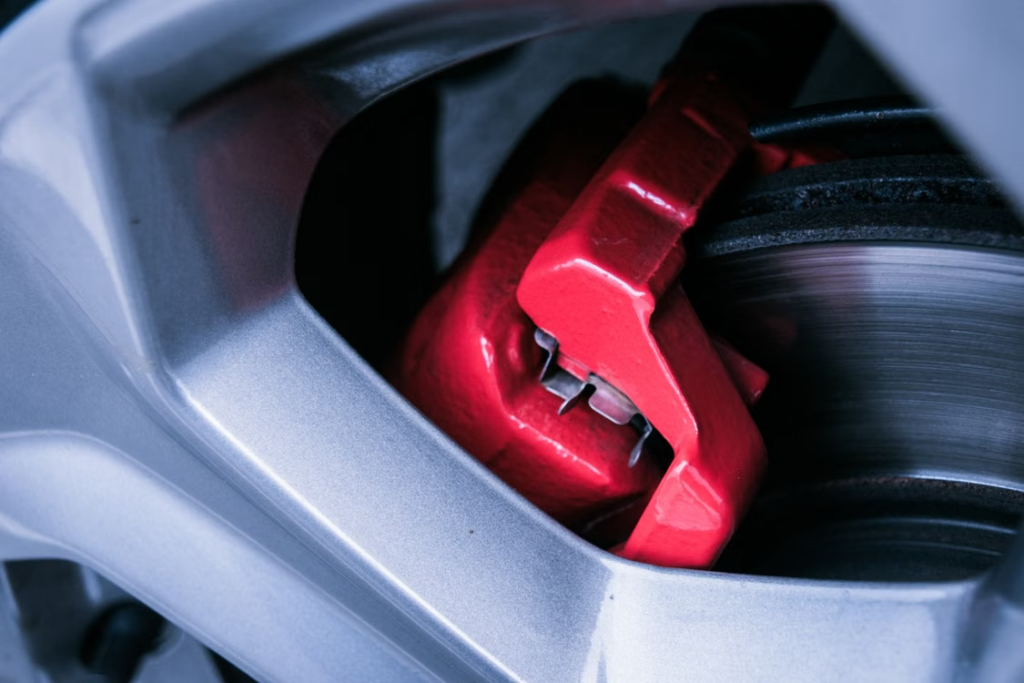 DIY Car Maintenance: Red brake caliper.