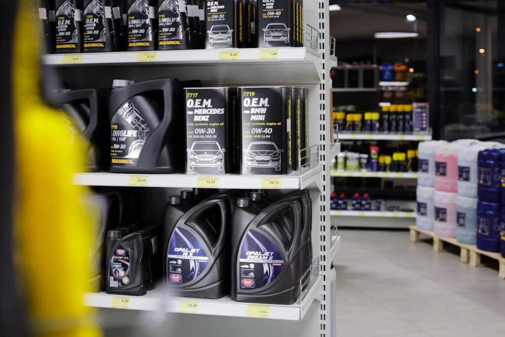 Car Maintenance Plans: containers of oil on the shelf.