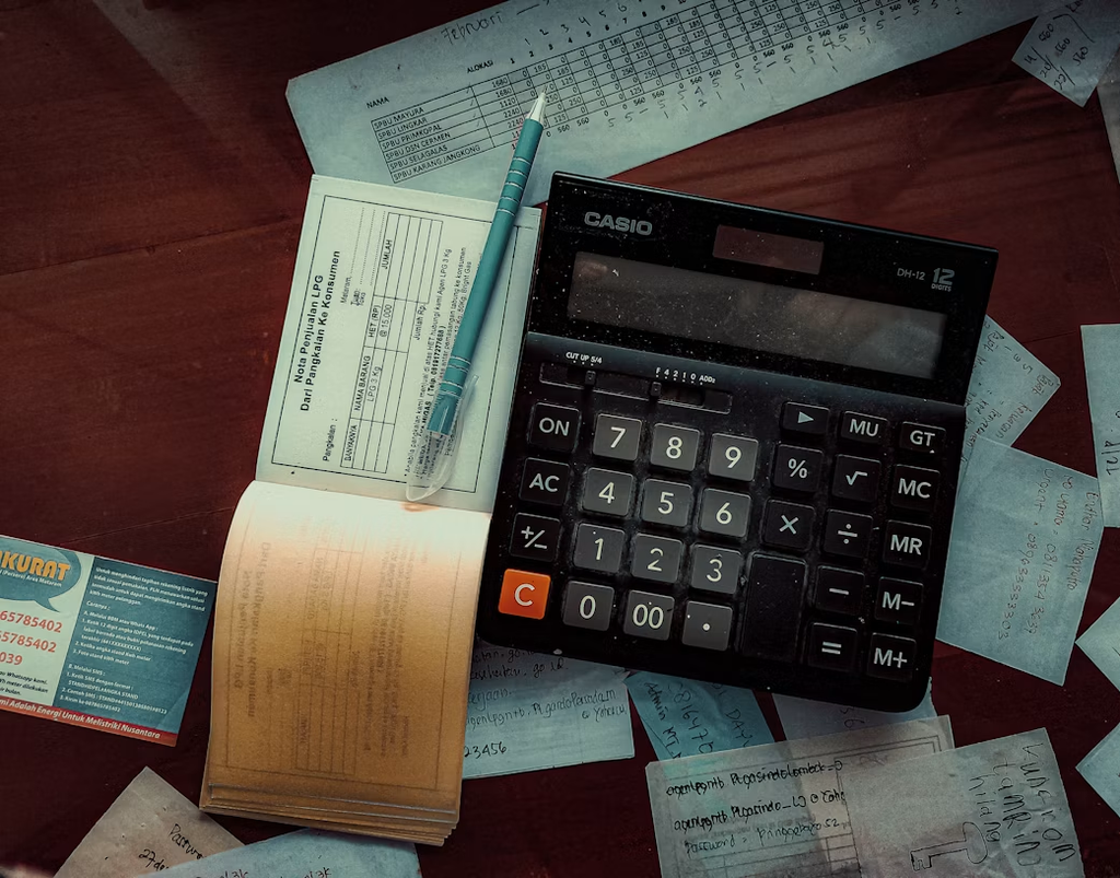 Transmission fluid replacement costs: an itemised quote next to a calculator.