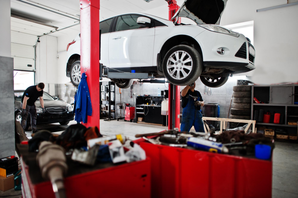 Transmission fluid replacement costs: a car at a workshop.